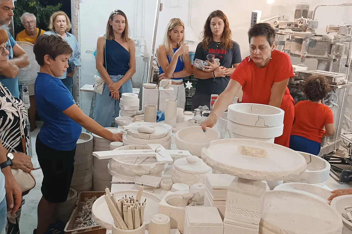 Guests discovering Brač stone during a guided stonemasonry workshop tour